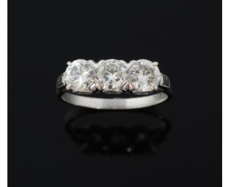 Three stone diamond ring. set with round brilliant cut diamonds mounted in platinum, total diamond weight 1.5 cts