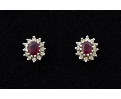 A pair of ruby and diamond cluster earrings. mounted in 18ct gold. 