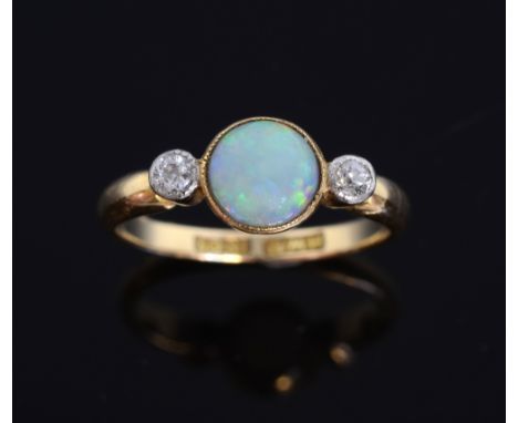  Cabouchon opal and diamond ring. in 18ct gold mount