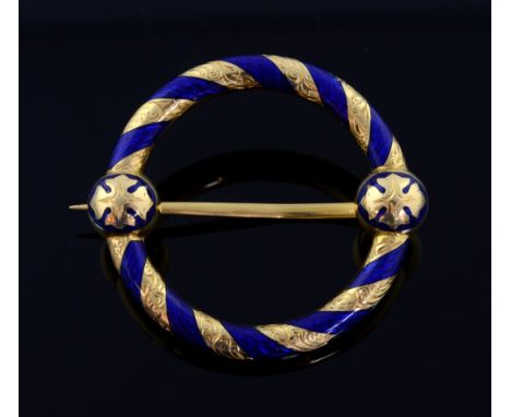 Fine 19th C circular brooch. in gold with chased decoration, gothic motif  and blue enamel, the reverse with glass oval conta