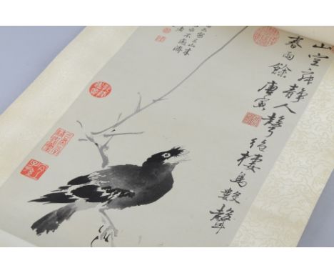 Chinese scroll depicting a bird on a branch, with calligraphy and thirteen red stamp marks, 116cm x 26cm,