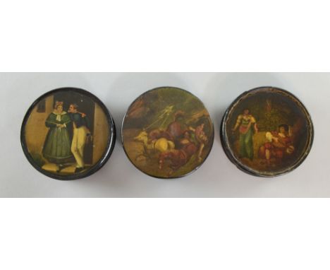 Three Stob Wasser designed circular boxes in black lacquer decorated with a soldier and his wife a hunting scene and serenade