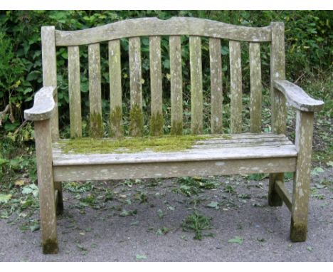 Teak garden bench with shaped back and slat back supports