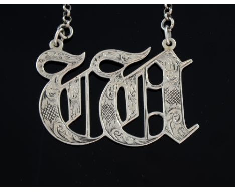 Victorian silver decanter label 'W' with bright cut decoration, by George Unite, Birmingham, 1866,