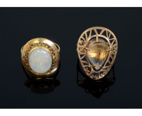 Opal and gold dress ring in and a smoky quartz dress ring in yellow metal, both 9ct gold