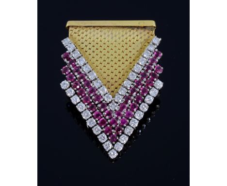 Ruby, diamond and gold clip, composed of a polished gold brick motif terminating in an arrow head  of four rows  of round bri