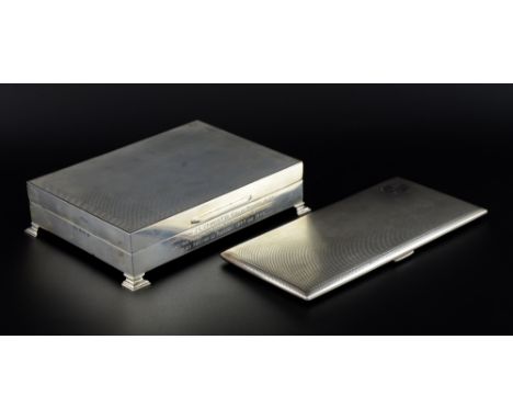 Modern silver cigarette box with engine turned decoration on shaped feet, by Turner & Simpson, Birmingham, 1964, and a simila