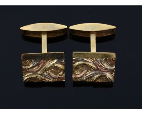 A pair of abstract design gold cufflinks. 