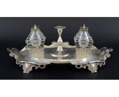 Victorian Scottish silver desk stand with twin inkwells, pen tray and candlestick with engraved decoration on four scroll fee