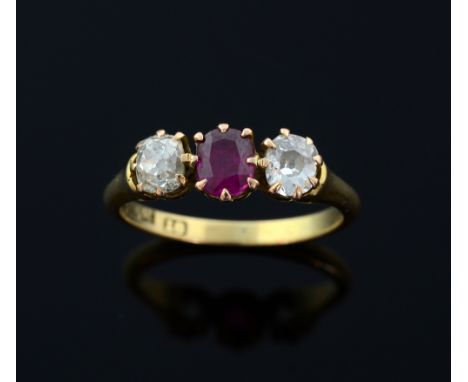 Ruby and diamond three stone ring, oval-cut ruby to the centre weighing 0.50cts flanked by two old cut diamonds,  weighing ap