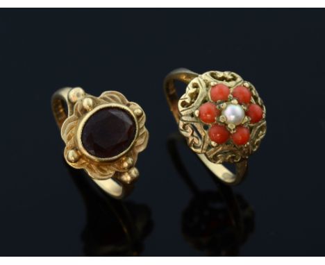 Two gem set rings.coral and pearl gold dress ring, 9ct gold and a garnet and 9ct gold ring 