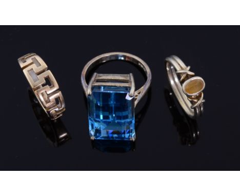 Blue topaz dress ring mounted in 9ct gold,  a citrine set ring, unmarked and another with Greek key design 14 ct 