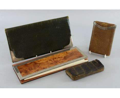 Edward VII green leather and silver mounted document wallet, London, 1909, silver mounted and leather calendar, a cigar case 