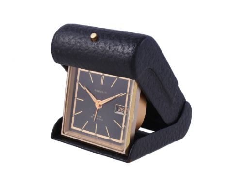  Gubelin, a gilt metal and leather travelling alarm clock,   Swiss 8 day alarm movement, 15 jewels, no. 985156, black dial, a