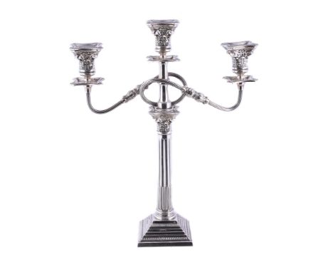  A silver three light candelabrum by Alexander Smith,   Birmingham 1959, with beaded sconces, the capital chased with foliate