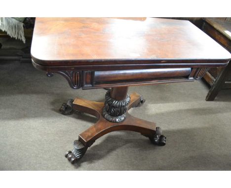 19th century mahogany card table with folding revolving baize lined top over a turned column, platform base and four scrolled
