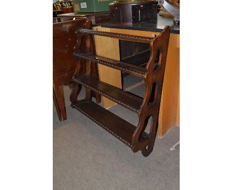 Late 19th Century mahogany four tier wall shelf with pierced sides