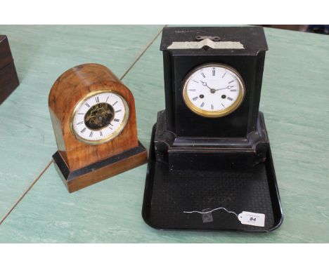 A late 19th Century black painted wood case chiming mantle clock, the face marked Edgar &amp; Co. with key, 10 1/2" high toge
