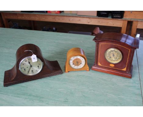 Three wooden cased mantel clocks, including an inlaid example with brass face, chiming with key, 11" high, an Art Deco Smiths