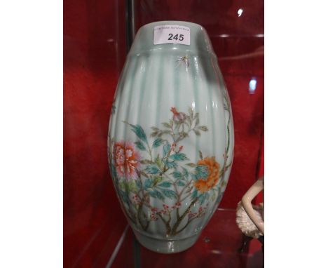 A C20th Chinese porcelain celadon lobed vase with botanical decoration converted into a lamp