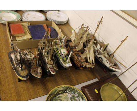 Six wooden model boats