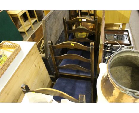 A set of four Ercol ladder back dining chairs