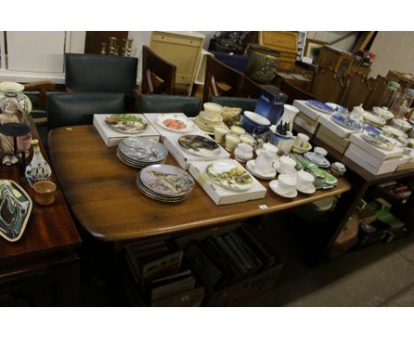 An Ercol dining table with a set of six oak chairs to include two carvers