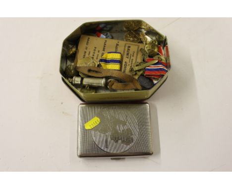 A tin of mixed medals, badges, cigarette case etc.