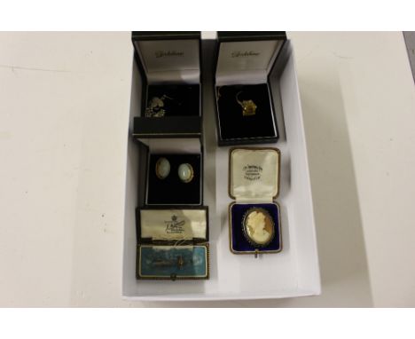 A box of jewellery to include a silver mounted Cameo brooch; a yellow metal ring, AF; a pair of Jade style set ear-rings; a b