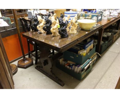 An Ercol oak draw leaf table