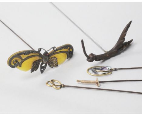 Five assorted hatpins including enamel, horn and French 18ct gold.The property of:Mrs BA Hamilton-Deeley deceased.The proceed