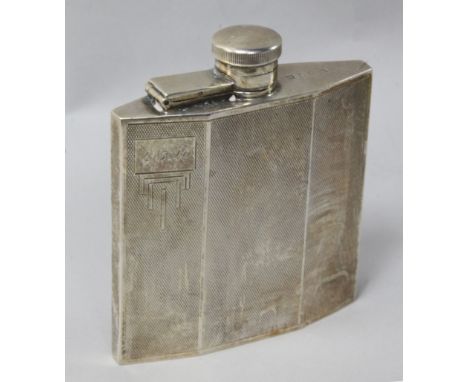 A 1930's Art Deco engine turned silver hip flask, 10.3cm.