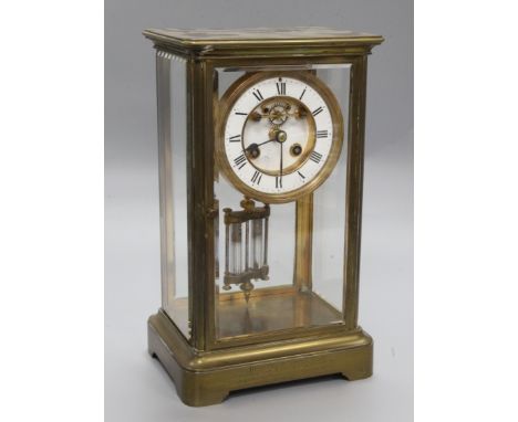 A Victorian brass four glass mantel clock, with mercury pendulum and R & Cie movement, height 30cm