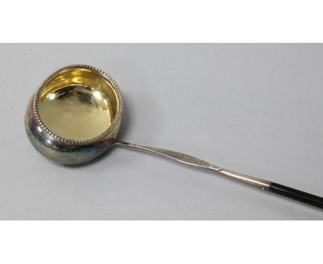 A George III silver toddy ladle with baleen handle, 41cm.