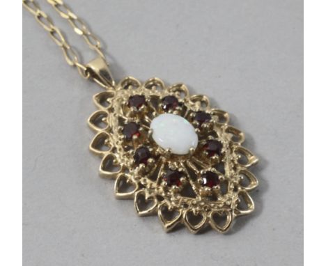 A modern 9ct gold, white opal and garnet pendant, on a 9ct gold chain, pendant 27mm.