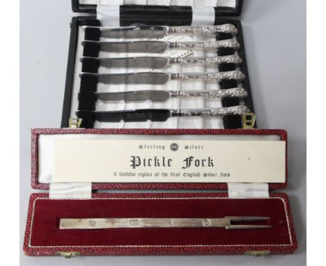 A set of six silver handled tea knives and a modern silver pickle fork.