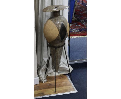 A large studio stoneware flask with wrought iron stand, height 103c,