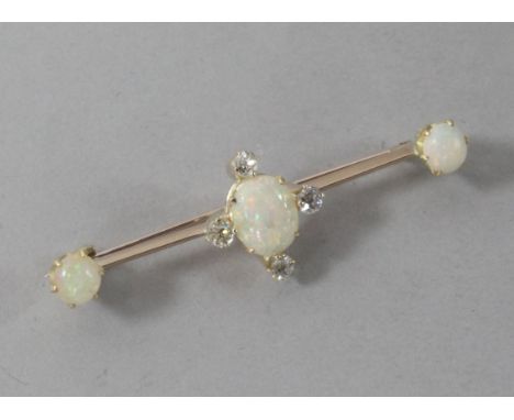 A gold, white opal and diamond set bar brooch, 51mm.