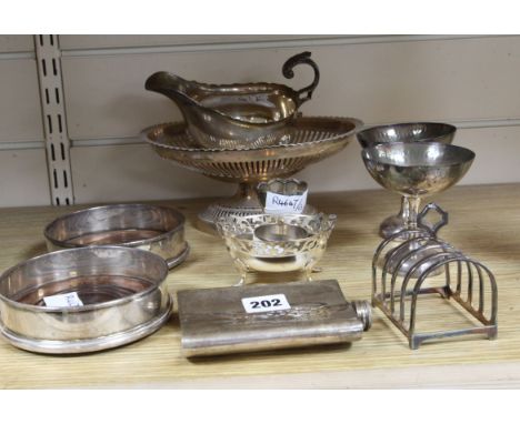 A pair plated Mappin & Webb coasters, a Mappin & Webb hip flask, two sauceboats, fruit basket, toastrack and five other items