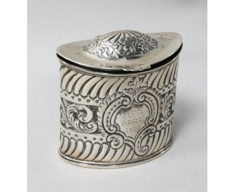 A late Victorian repousse silver oval tea caddy, Birmingham, 1897, height 82mm, 3.9 oz.
