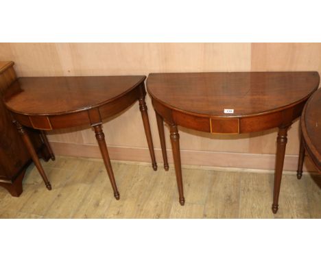 A pair of Georgian style mahogany demi-lune console tables, W.3ft