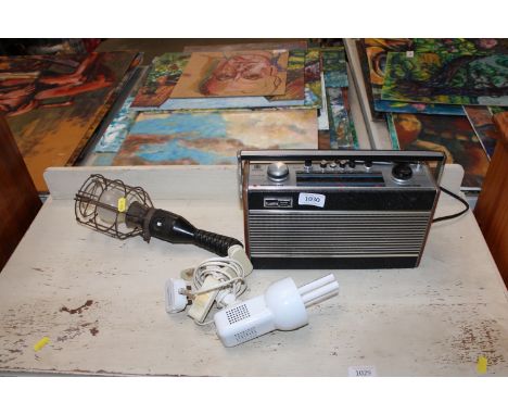 A Stadium light, sold as a collectors item; a Roberts radio and a clip on light