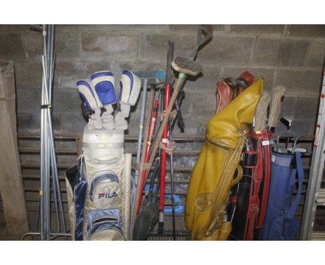 A collection of various garden tools to include rakes etc.