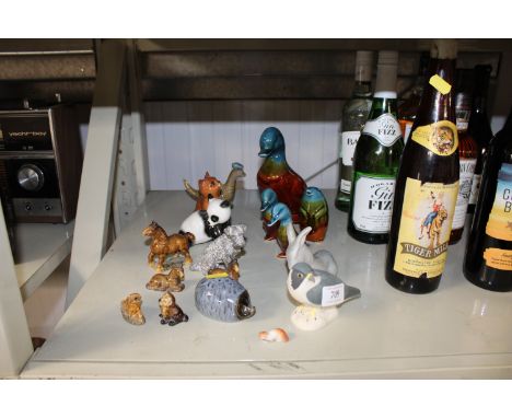 A collection of various ornaments to include an Isle Arran Scottish figure of a bird, a USSR figure of a panda, a Beswick fig