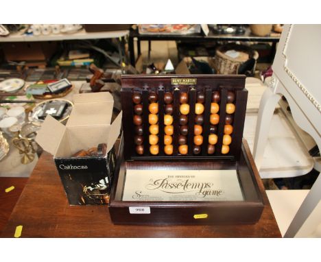 A quantity of draught pieces and a Remy Martin Cognac game