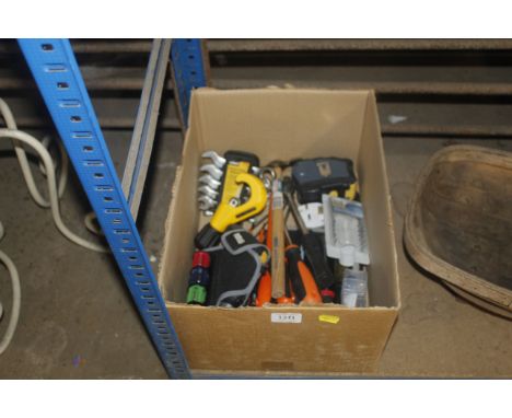 A box containing various tools to include a spanner set, hammers etc.