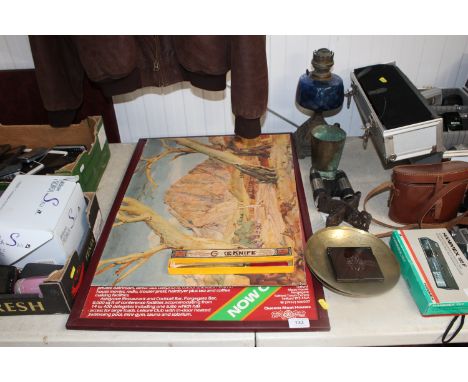 An oil lamp having blue glass reservoir, a silver plated tankard, two brass trays, a wooden oriental stand, two prints and a 
