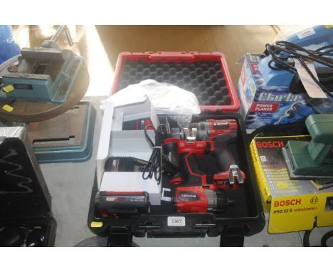 An Einhell drill driver and an impact driver with battery chargers in fitted case