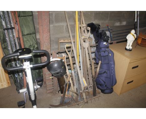 A collection of various garden tools to include rakes, forks, brushes etc.