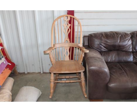 A pine stick back rocking chair 